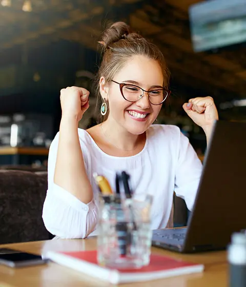 Businesswoman celebrating successful debt recovery with no win, no fee