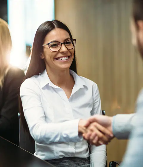 Businesswoman celebrating successful debt recovery with no win, no fee