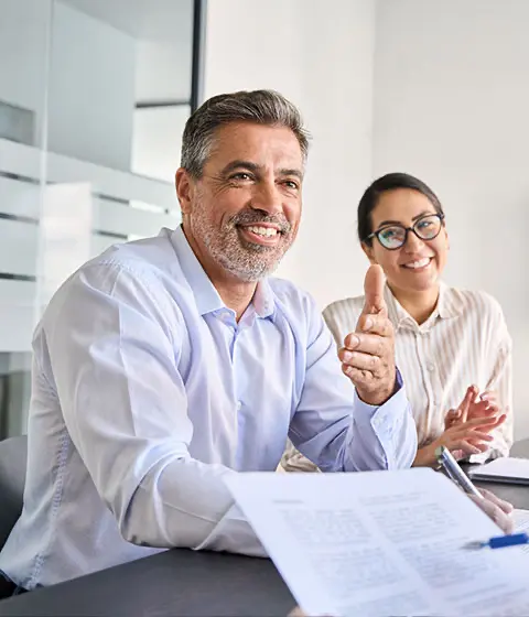 Business owner talking to business-to-business (B2B) debt recovery firm